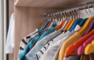Stylish,Boy's,Clothes,Hanging,In,Wardrobe,,Closeup