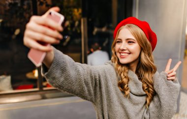 Happy,Girl,In,French,Style,Clothes,Makes,Selfie,On,Pink
