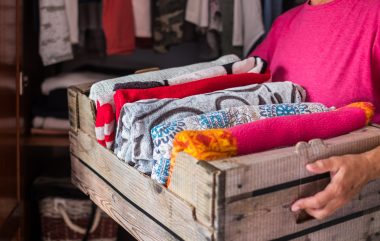 Woman,Of,The,House,Arranges,The,Blankets,In,A,Container