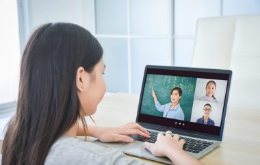 Asian,schoolgirl,online,learning,with,laptop,at,home.,education,and