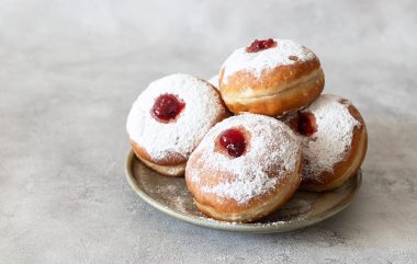 Tasty,Donuts,With,Jam,On,Wooden,Background,-,Hanukkah,Celebration