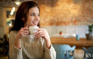Woman,In,A,Cafe,Drinking,Coffee