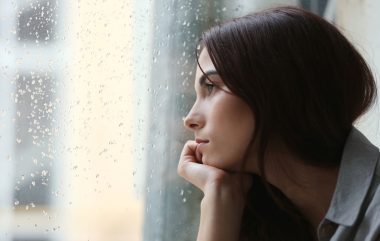 Depressed,Young,Woman,Near,Window,At,Home,,Closeup