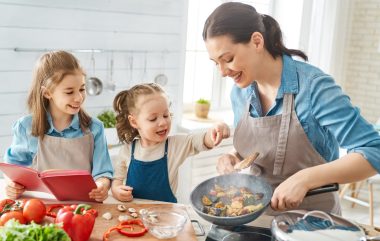 Happy Family In The Kitchen.