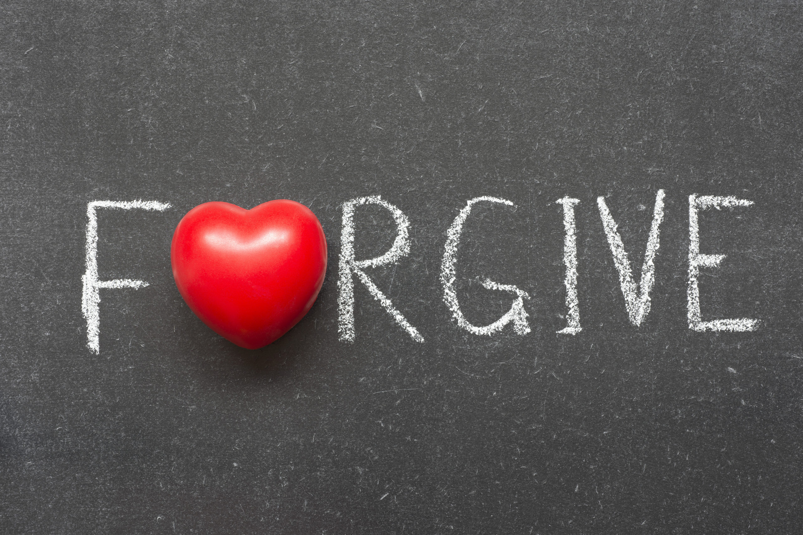Forgive,Word,Handwritten,On,Chalkboard,With,Heart,Symbol,Instead,Of