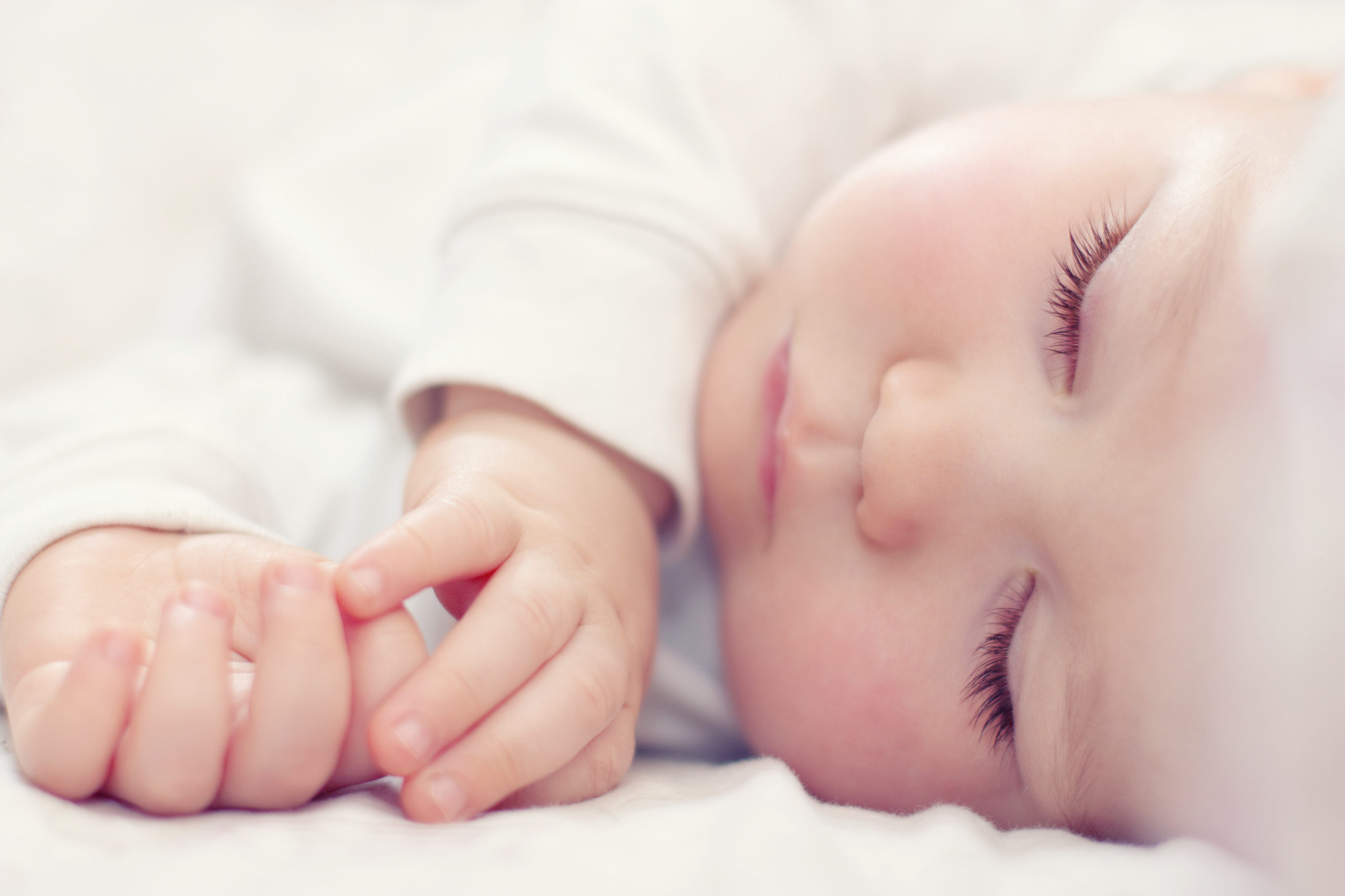 Close Up,portrait,of,a,beautiful,sleeping,baby,on,white