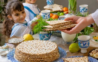 Firefly-passover-table-with-matzah-and-a-children-with-Kippa-around-the-festive-of-the-feast-59290