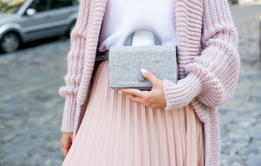 Fashionable,young,blond,woman,wearing,rose,cardigan,,beige,midi,skirt